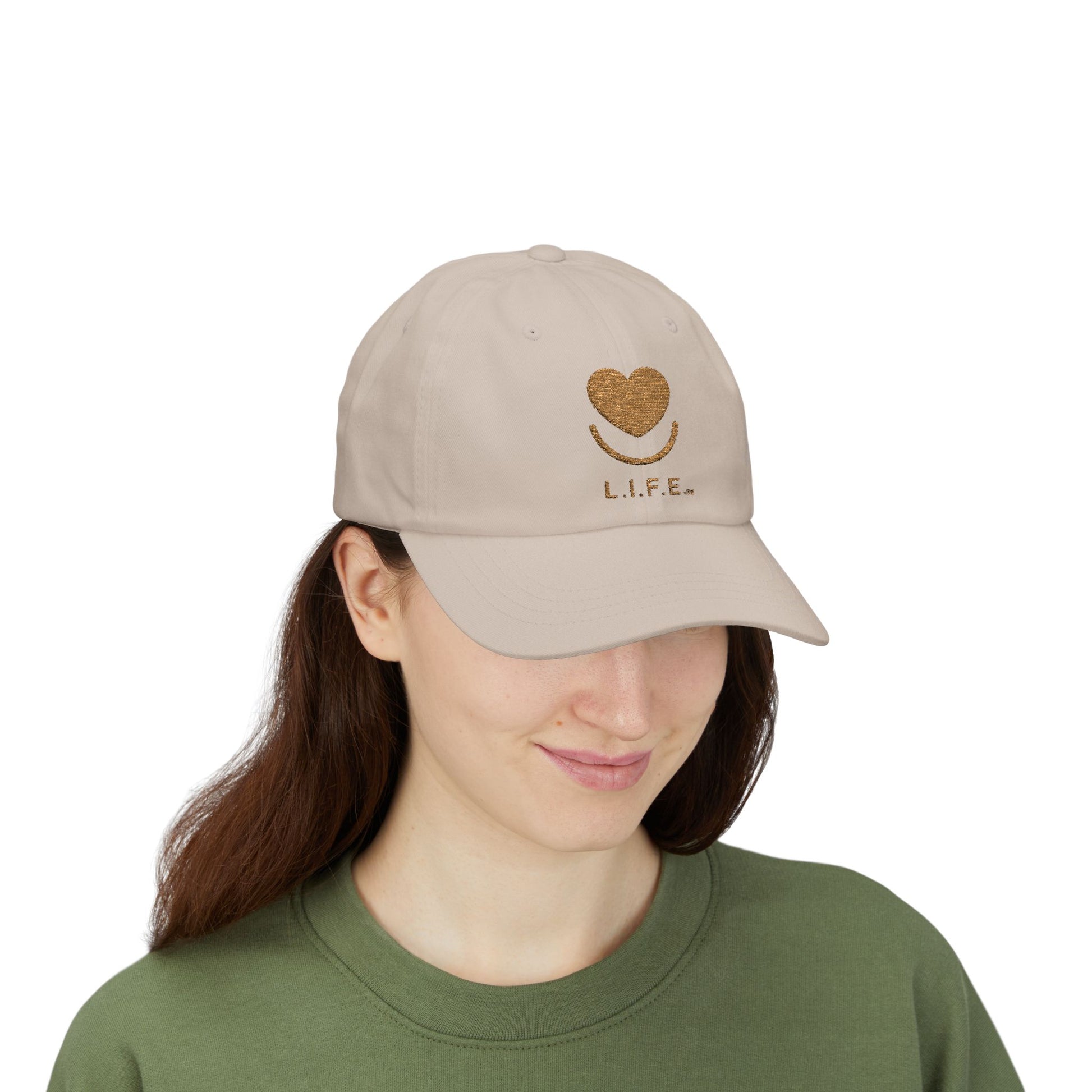 Woman wearing stone L.I.F.E. tonal embroidered dad hat with heart logo.