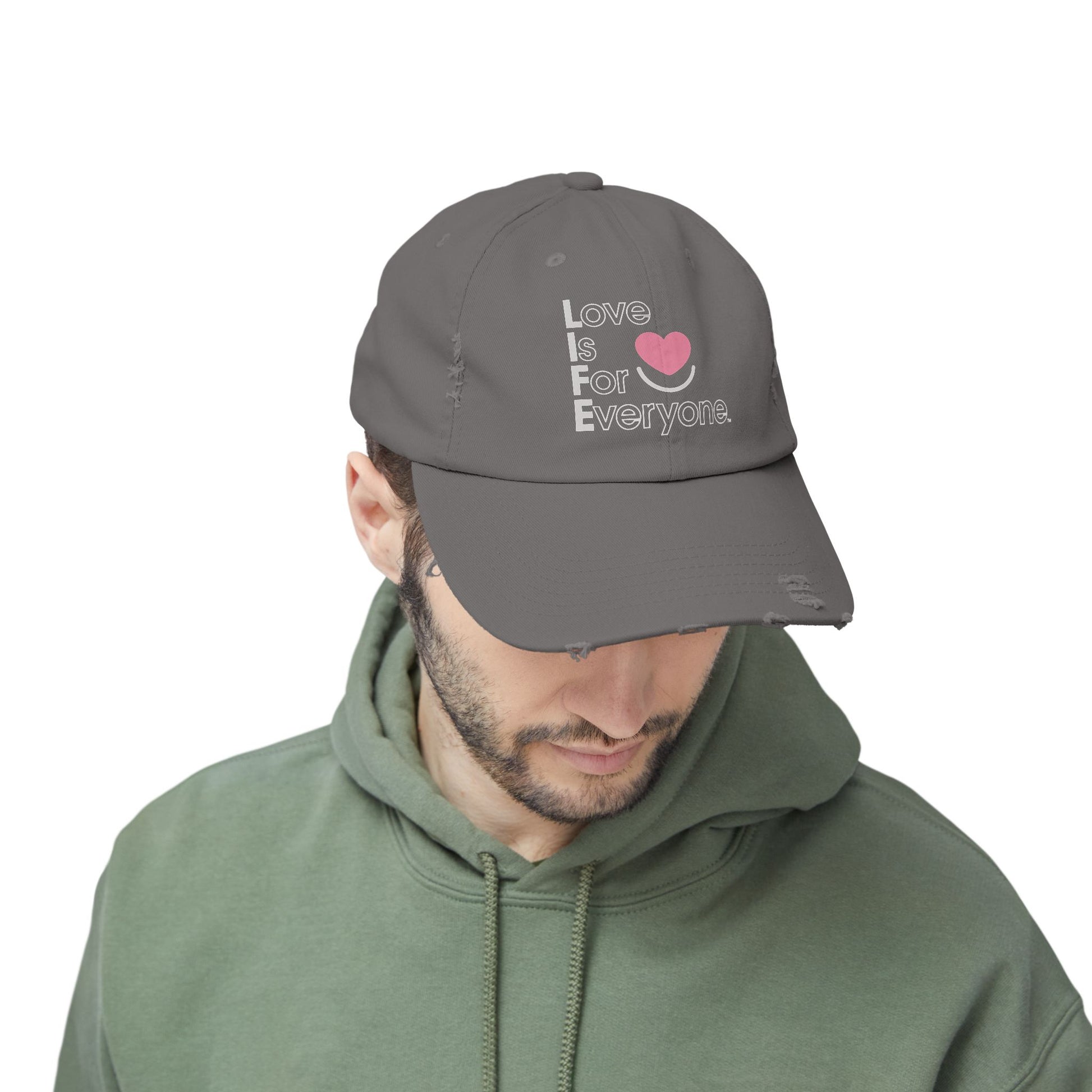 Man wearing charcoal L.I.F.E. Colorful Expressions dad hat with vertical logo.