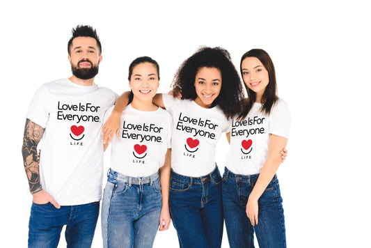 Four people wearing white t-shirts with "Love is for Everyone" text and a red heart smilel on a white background.