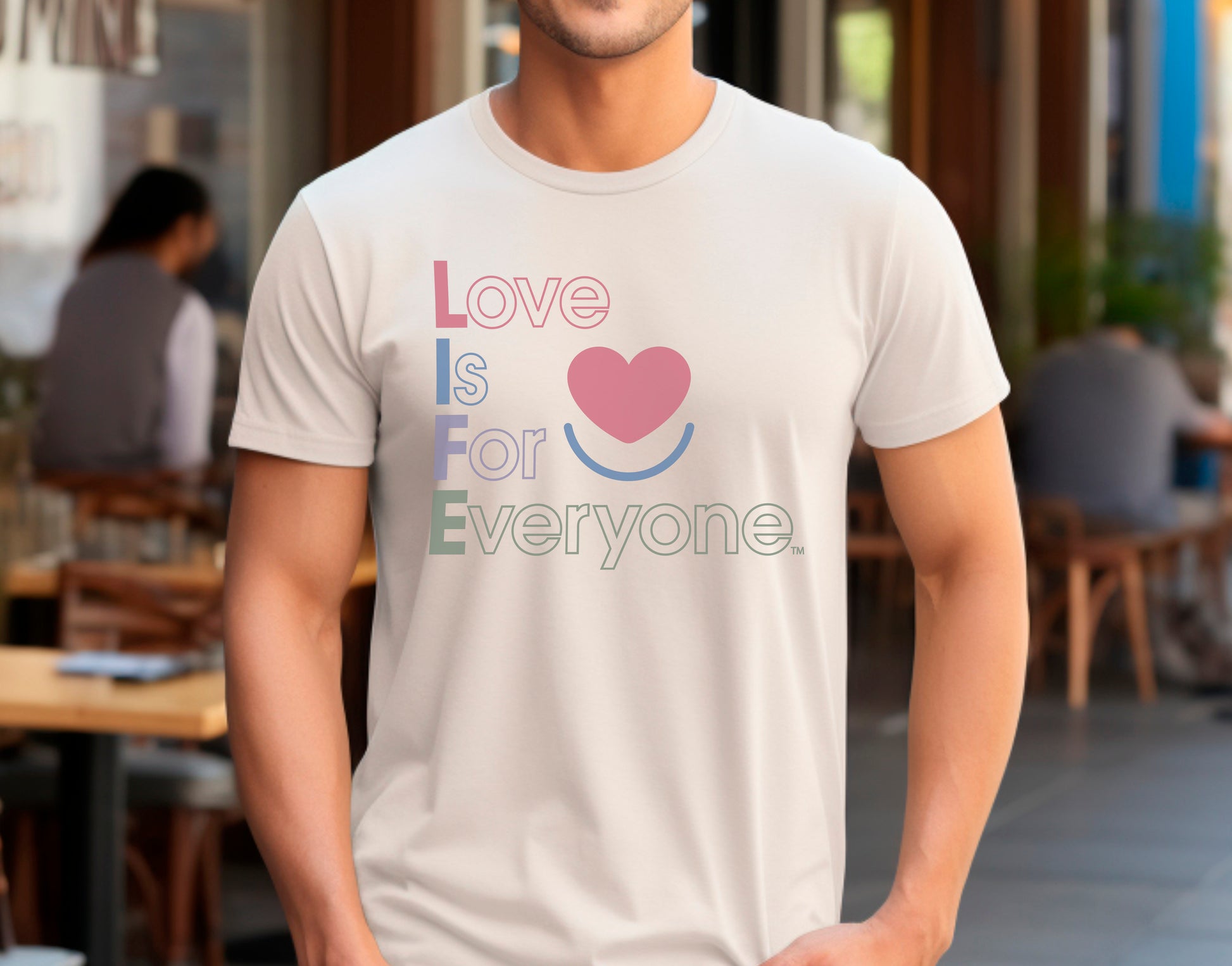 Man wearing sand men's Color Pop graphic tee, front view with vertical design.