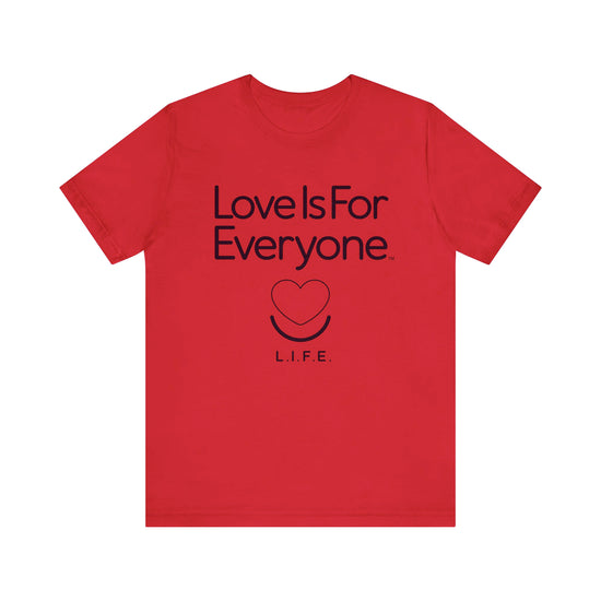 Men's Classic Tee laid flat, chest heart logo and message “Love is for Everyone”.