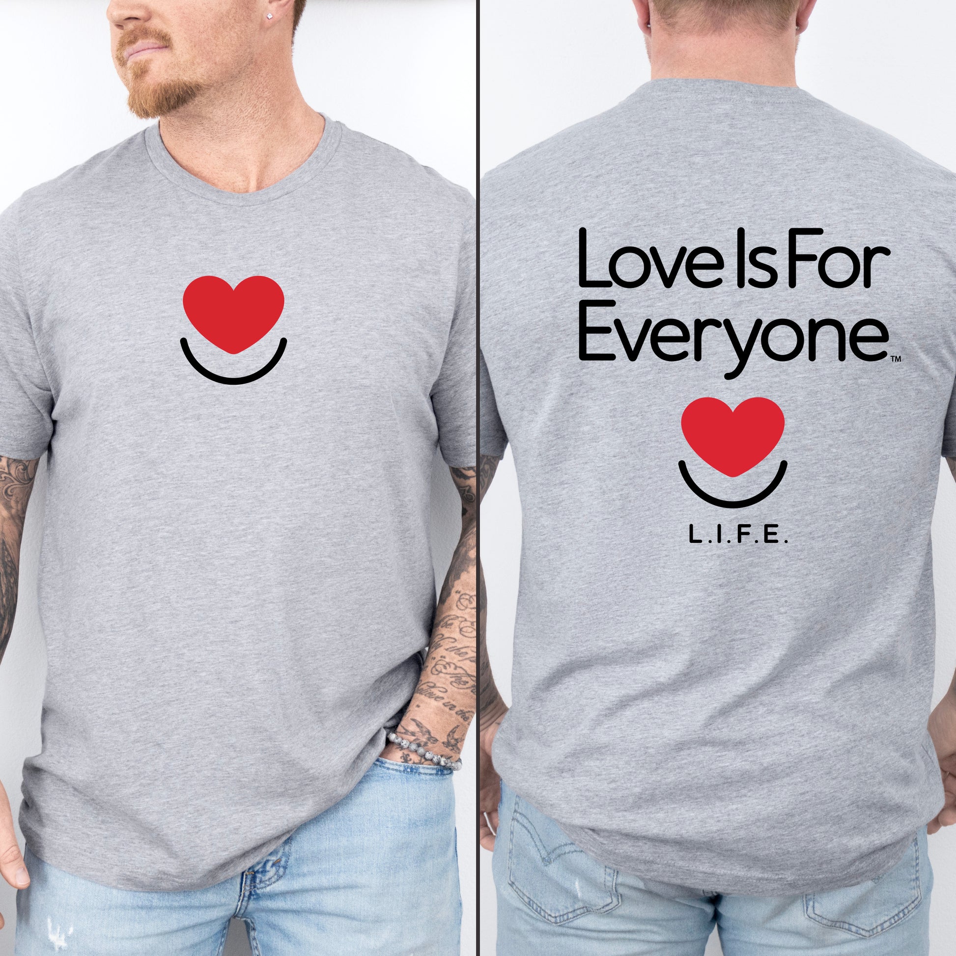 Man wearing men's Signature Tee in grey, front view with heart smile and "Love is for everyone" on back.