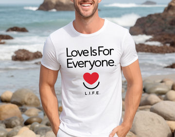 Man wearing men's white Classic Tee, front view with smiling heart and “Love is for Everyone” message.