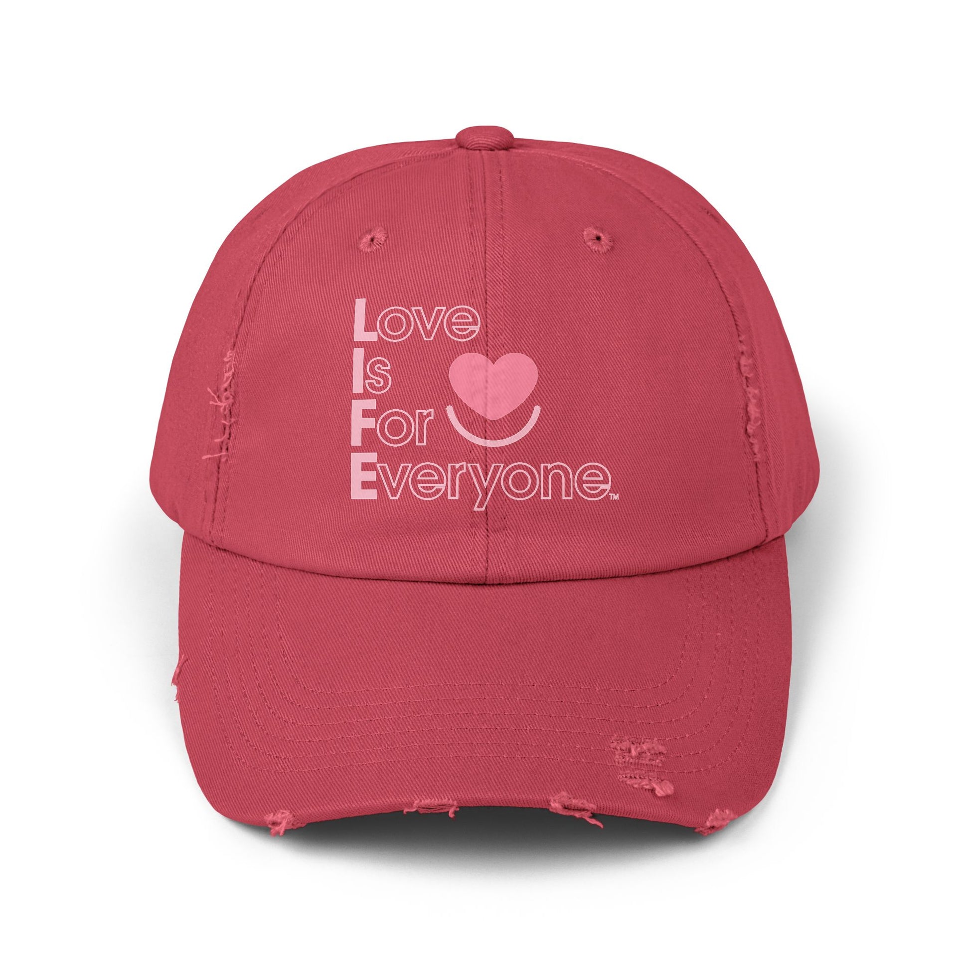 Front of red distressed cotton twill L.I.F.E. dad hat with heart logo and message.