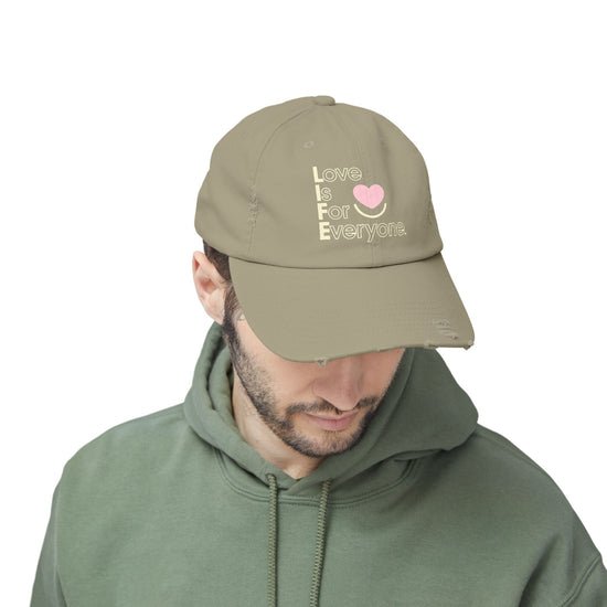 Man wearing olive L.I.F.E. Colorful Expressions dad hat with printed vertical logo.