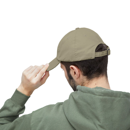 Side view of olive pigment-dyed L.I.F.E. dad hat showing distressed back details.