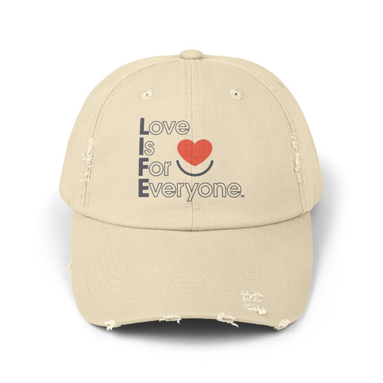 Front of stone distressed cotton twill L.I.F.E. dad hat with printed heart logo and message.