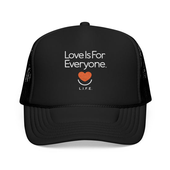 Front view of black L.I.F.E. trucker hat with embroidered "Love is for Everyone" and heart logo.