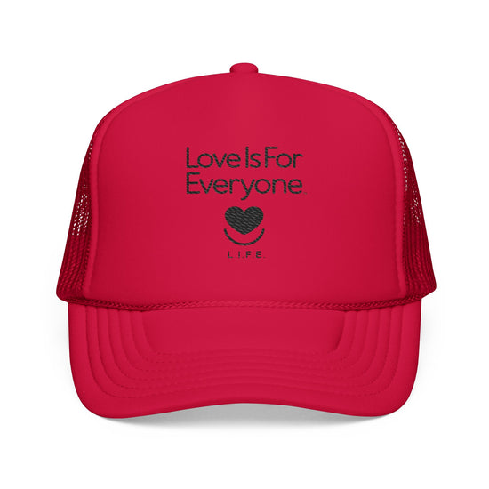 Front view of red L.I.F.E. trucker hat with embroidered "Love is for Everyone and heart logo.