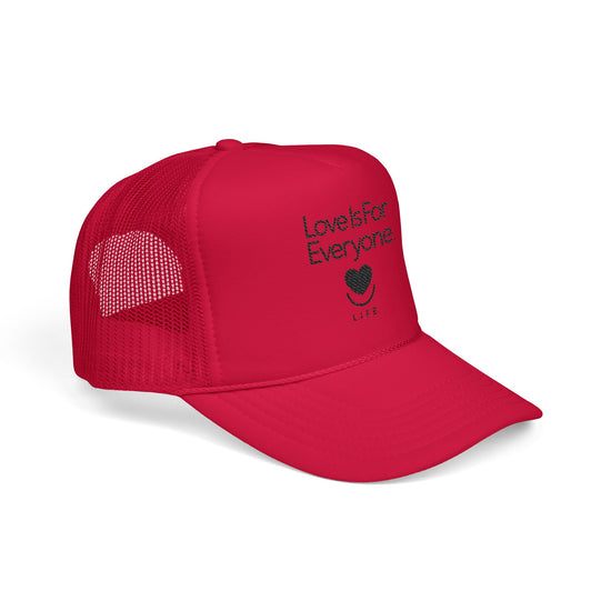 Angled view of red embroidered L.I.F.E. trucker hat showing structured bill and crown.