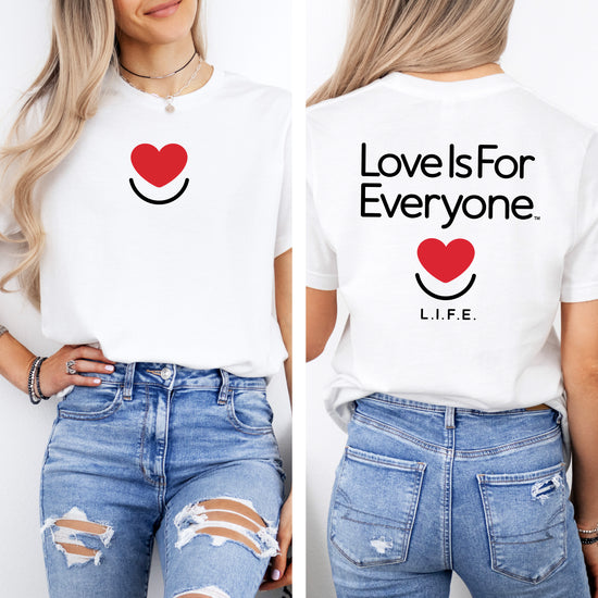 Woman wearing Signature white tshirt with front heart logo and back classic artwork.