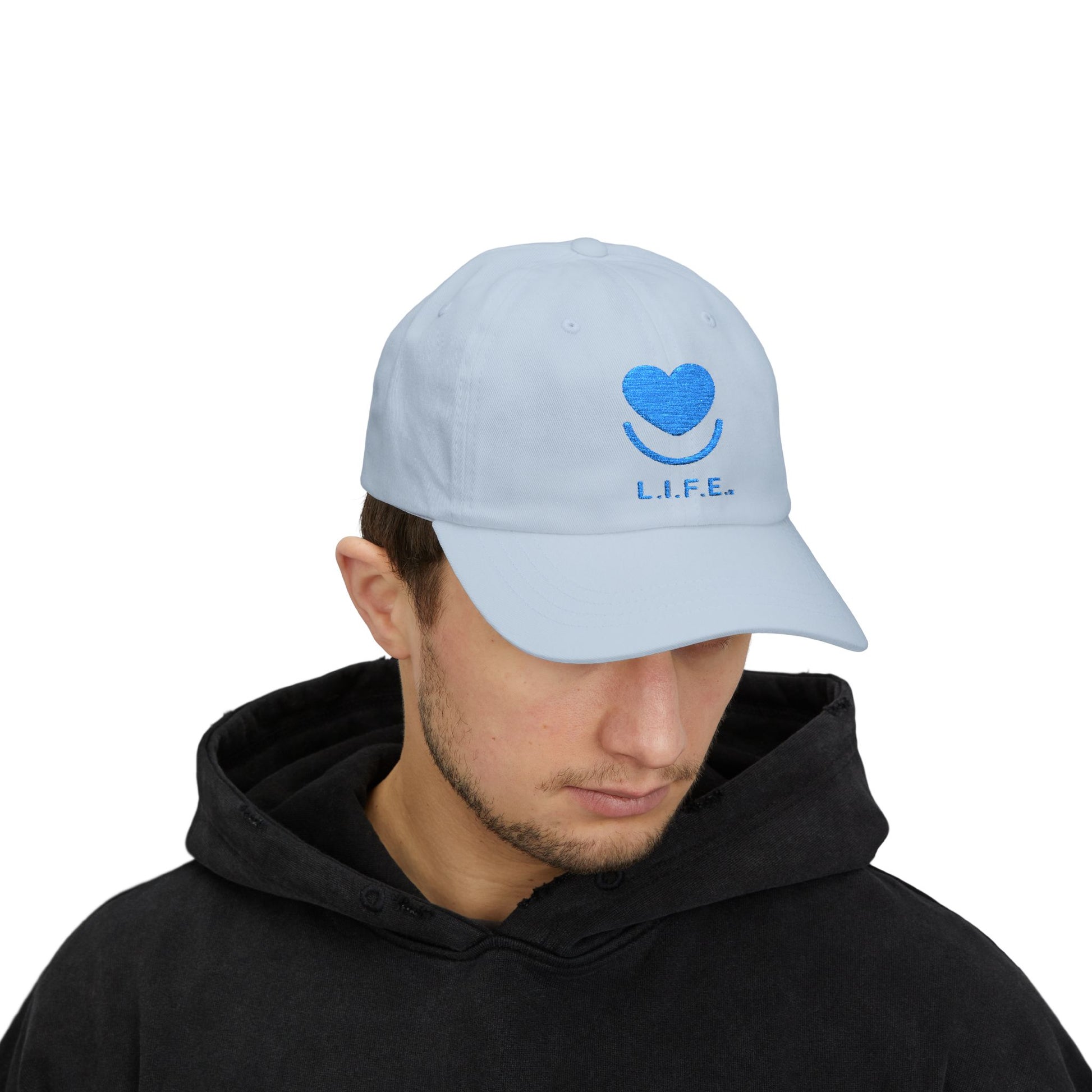 Man wearing light blue L.I.F.E. tonal dad hat with curved visor. 