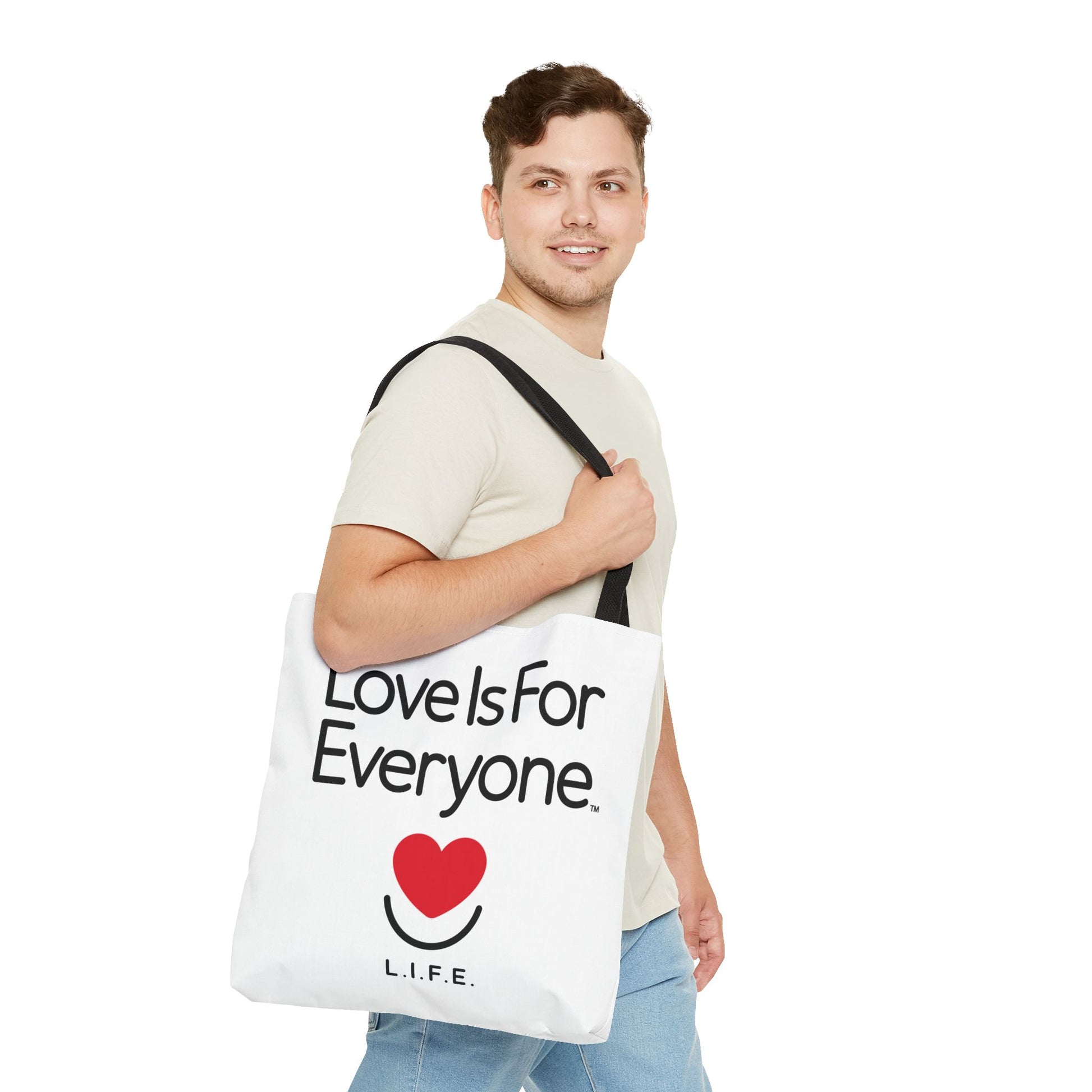 Man walking with 18'x18" Signature L.I.F.E. tote bag white with black contrast handles. 