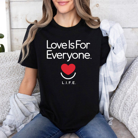 Woman wearing black L.I.F.E. "Love is for Everyone" Classic women's graphic T-shirt.