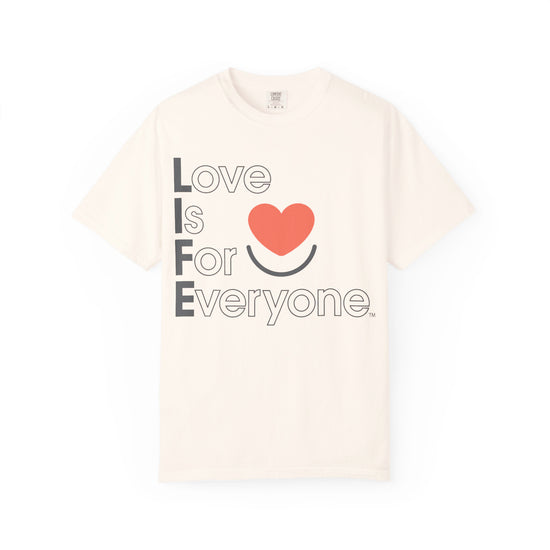 Ivory Comfort Colors® t-shrit laid flat with vertical "Love is for Everyone" heart design. 