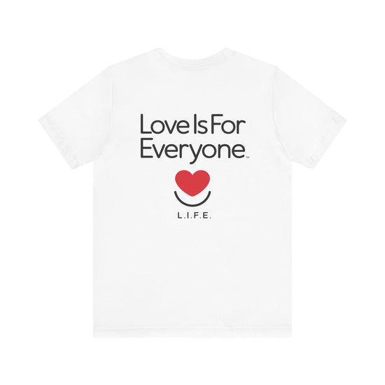 White Signature Tee back view laid flat with classic “Love is for Everyone” message. 